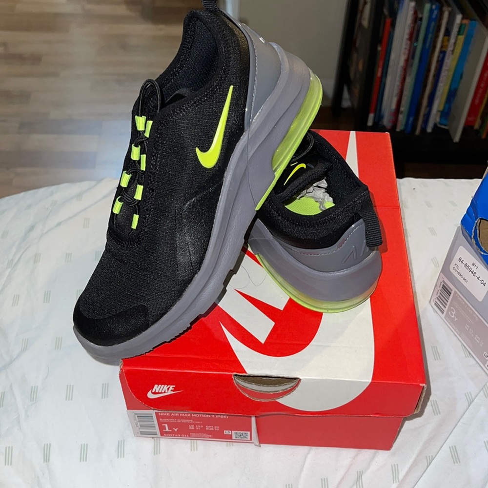 Black and neon yellow Nikes